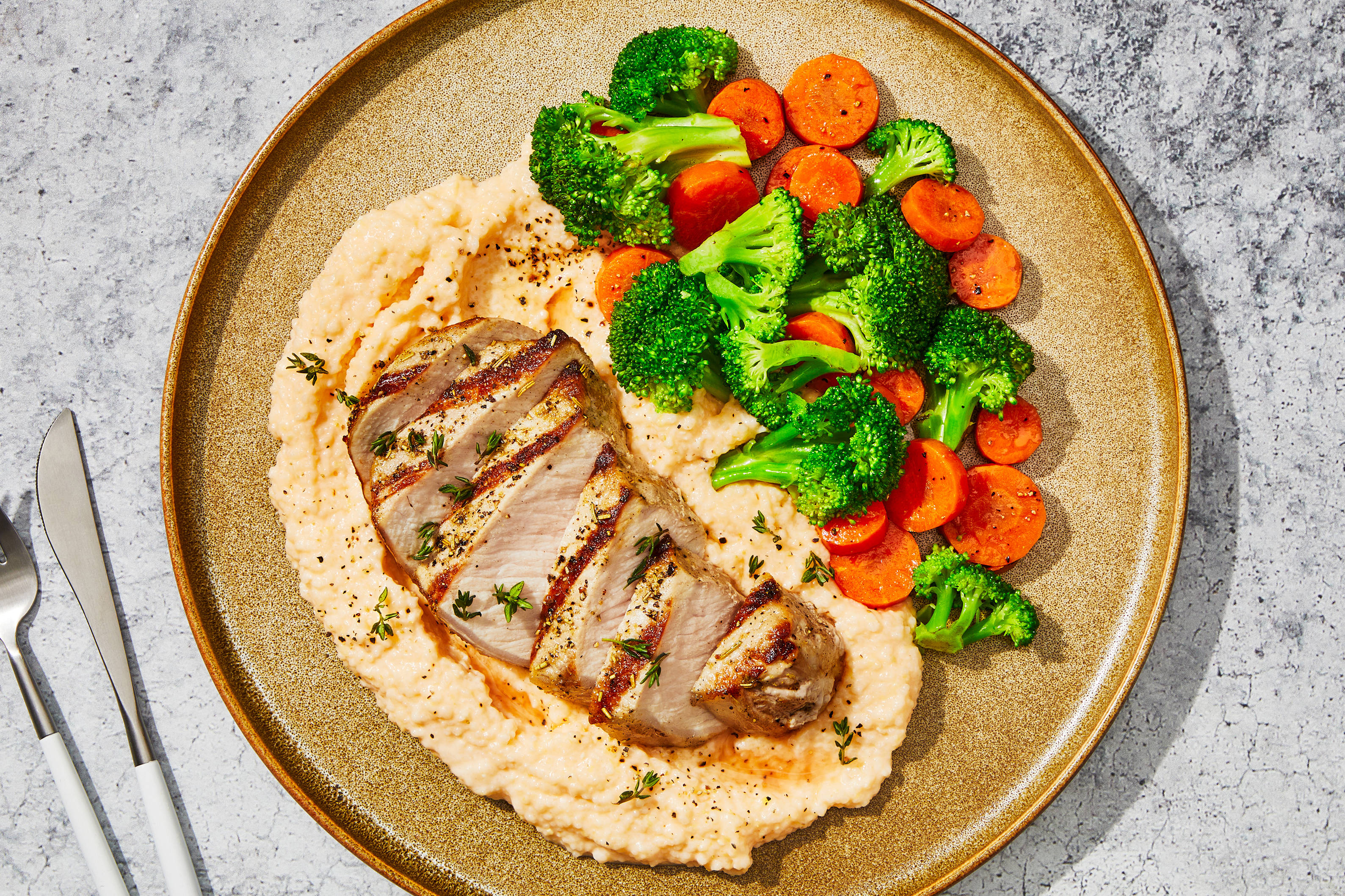 Sage & Rosemary Pork Chop with Smoky Cheddar Grits, Broccoli