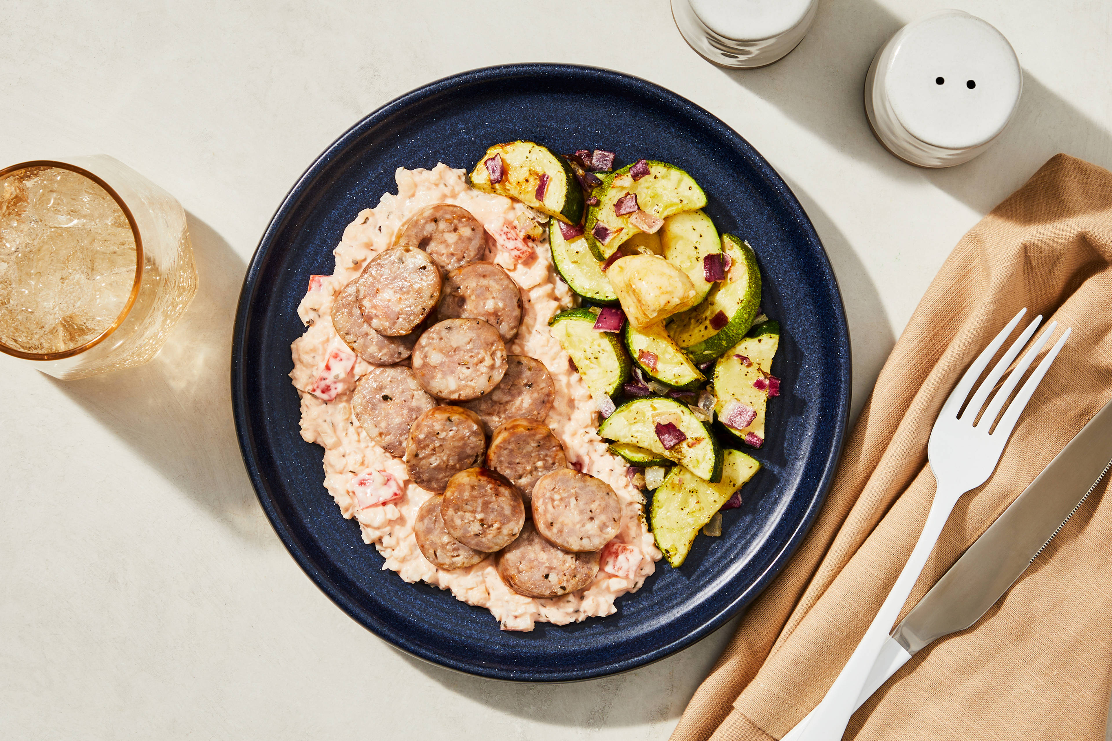Sliced Italian Sausage & Red Pepper Cauli Grits