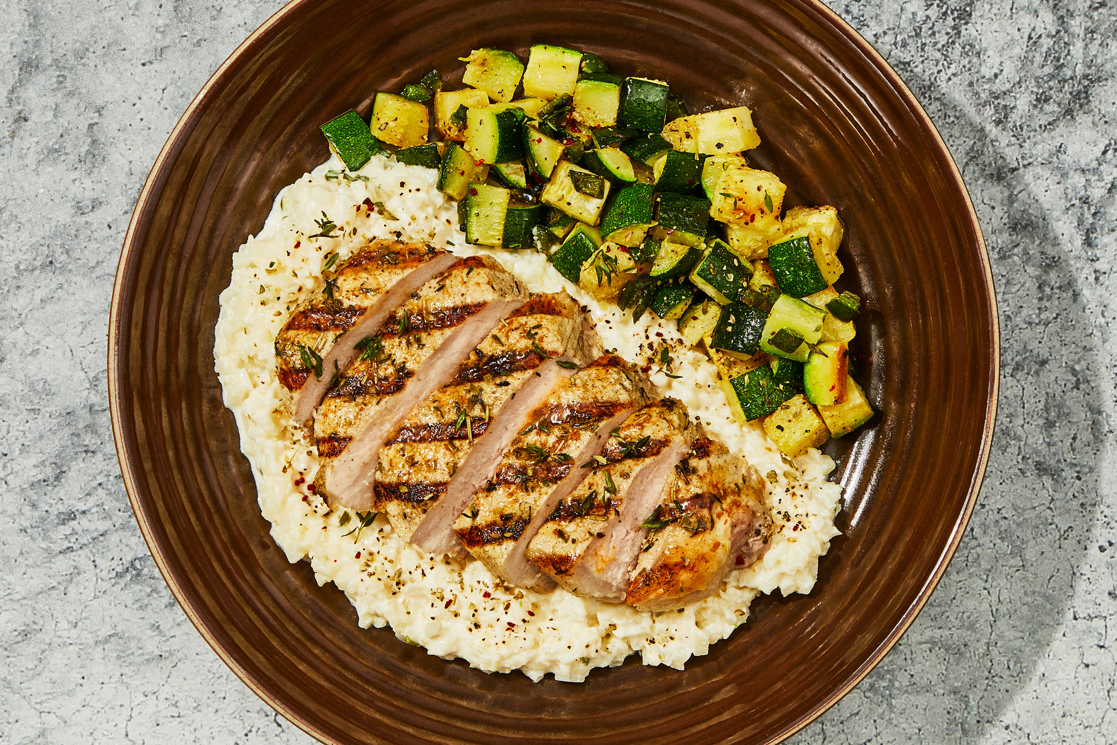 Grilled Pork Chop & Smoked Cheddar Cauli Grits