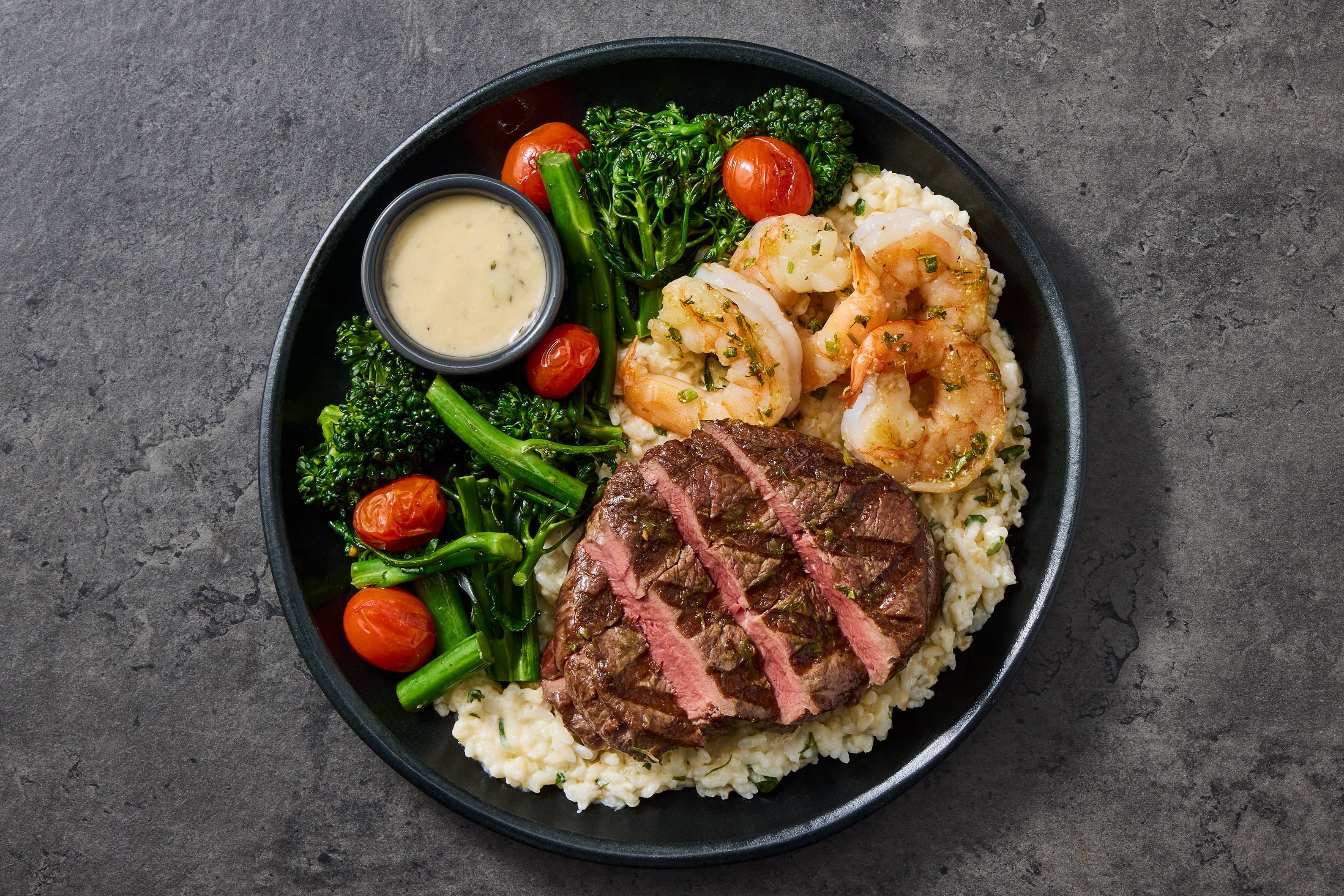Filet Mignon & Shrimp over Parmesan Risotto
